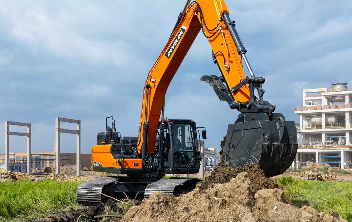 DEVELON -7 Series crawler excavator with thumb working at job site.