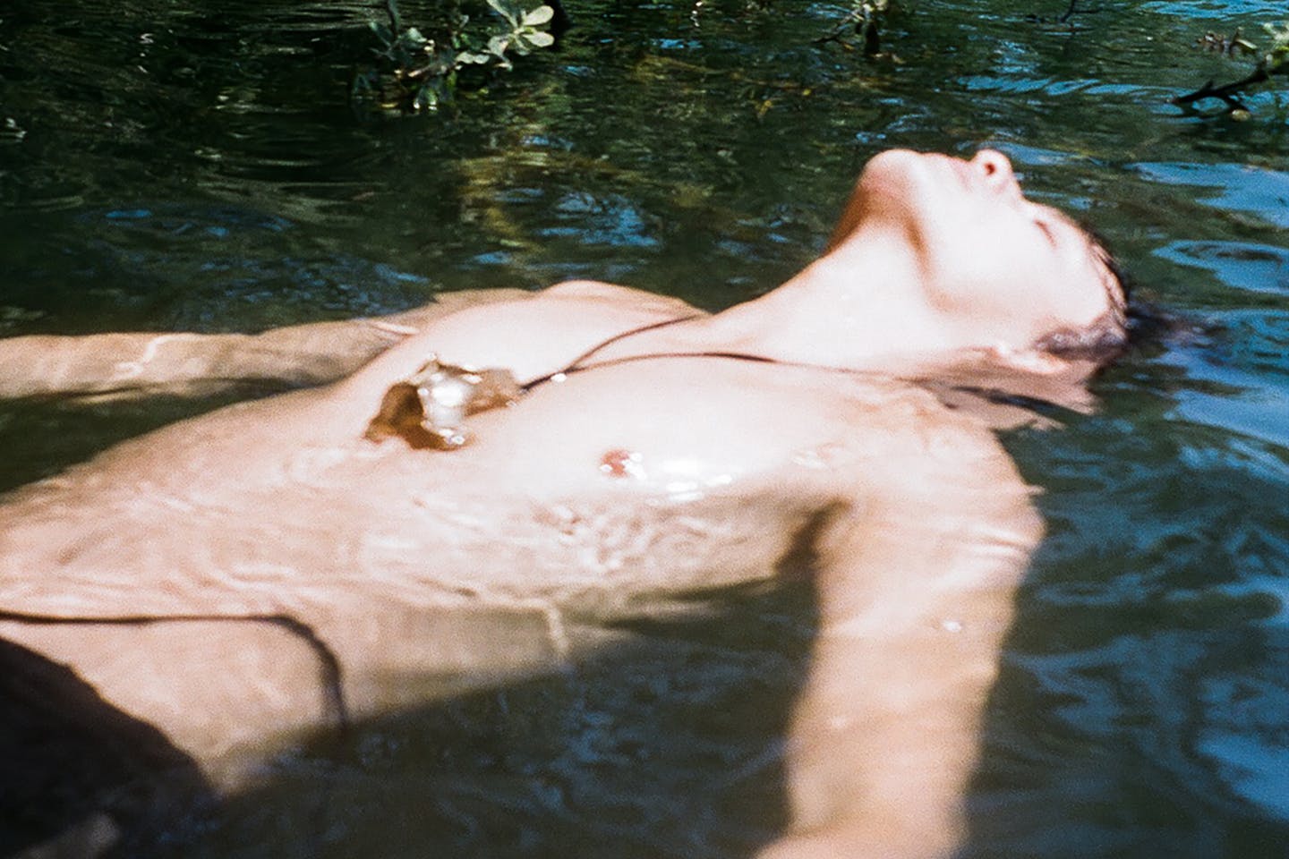 A portrait of a person floating in water from Ramazanov’s creative campaign for designer Oihana Lasa Pérez.