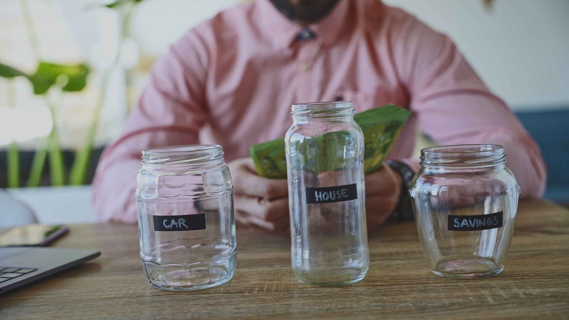 Man Counting Money for Savings, House and Car, Financial Planning Concept