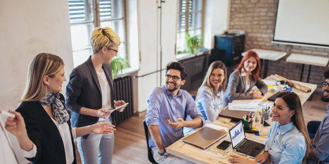 Business colleagues in conference meeting room during presentation