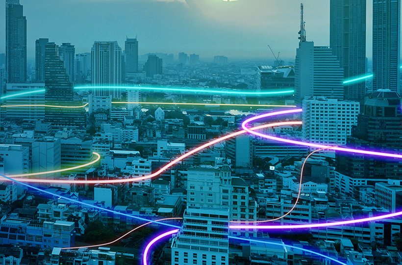 Stylised image of cityscape with fluoro/neon connections between buildings representing the Vocus Network. Used for the Vocus On-Net Campaign