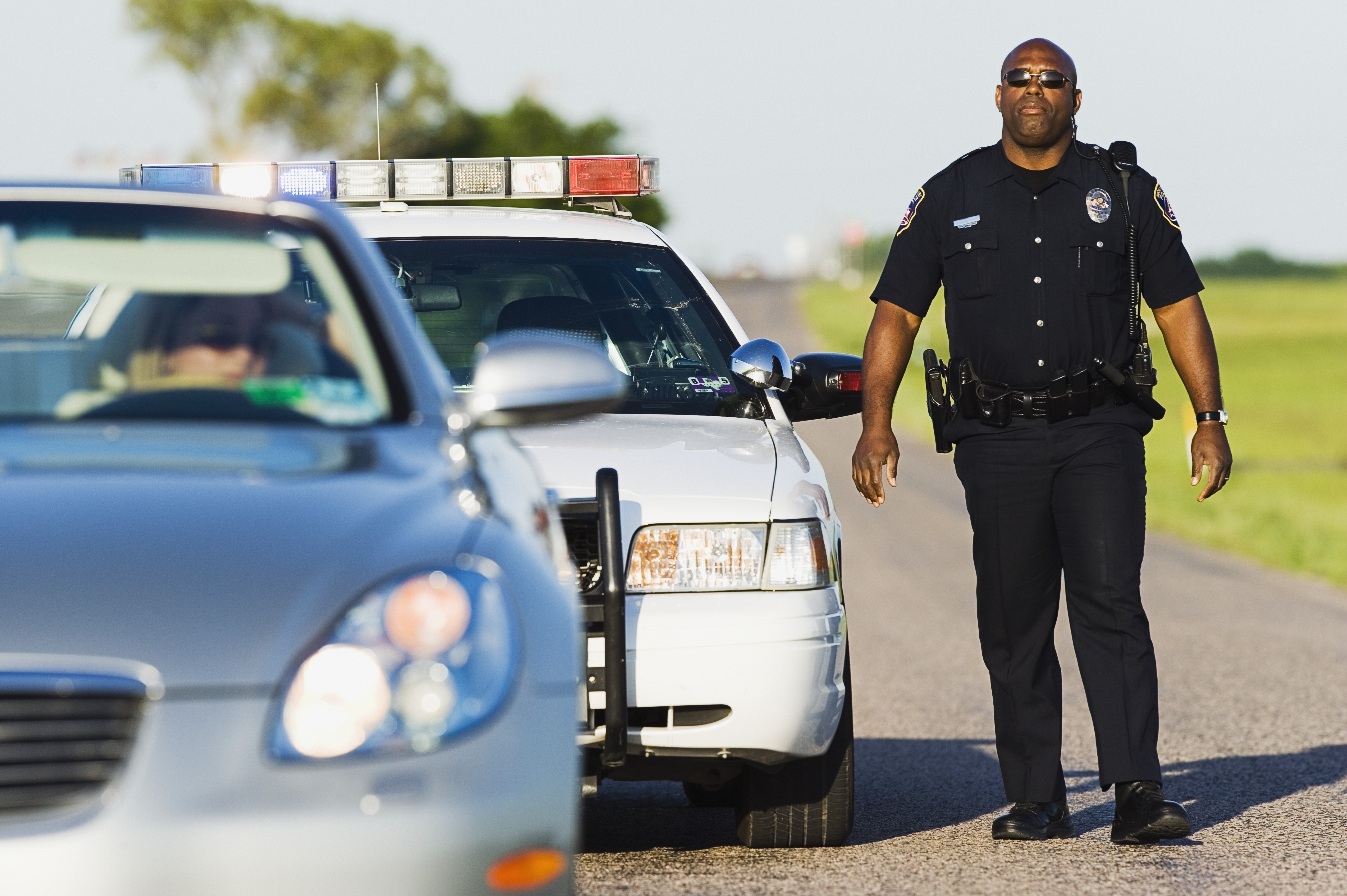 A police officer leverages police technology when pulling over a diver.