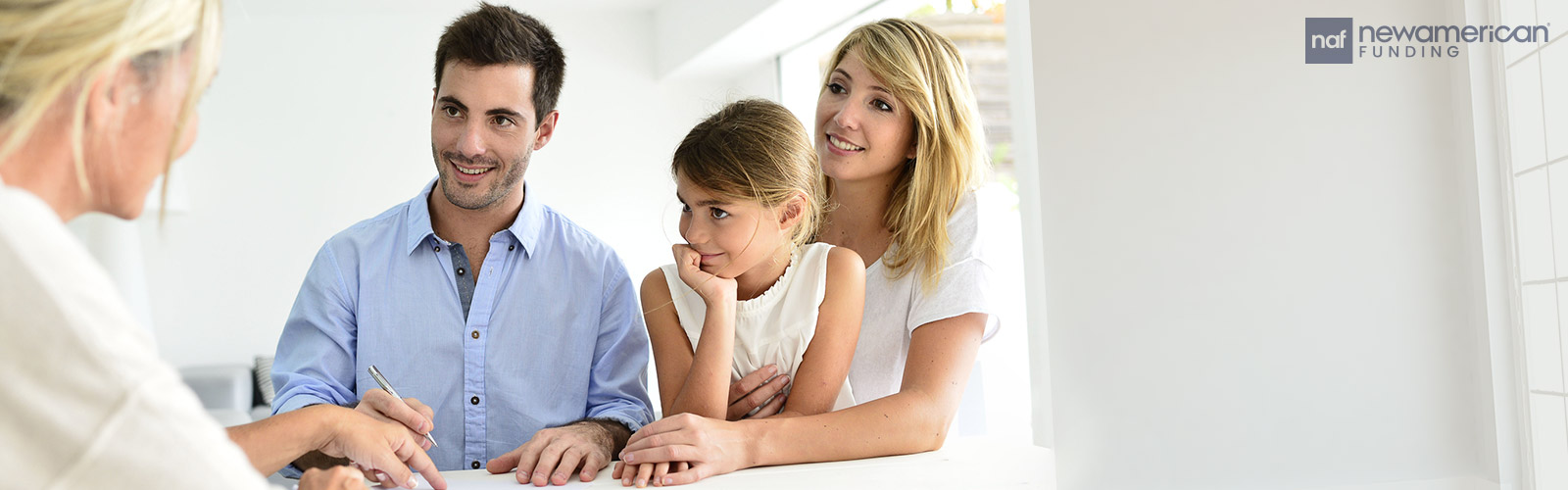 family going over paperwork with agent