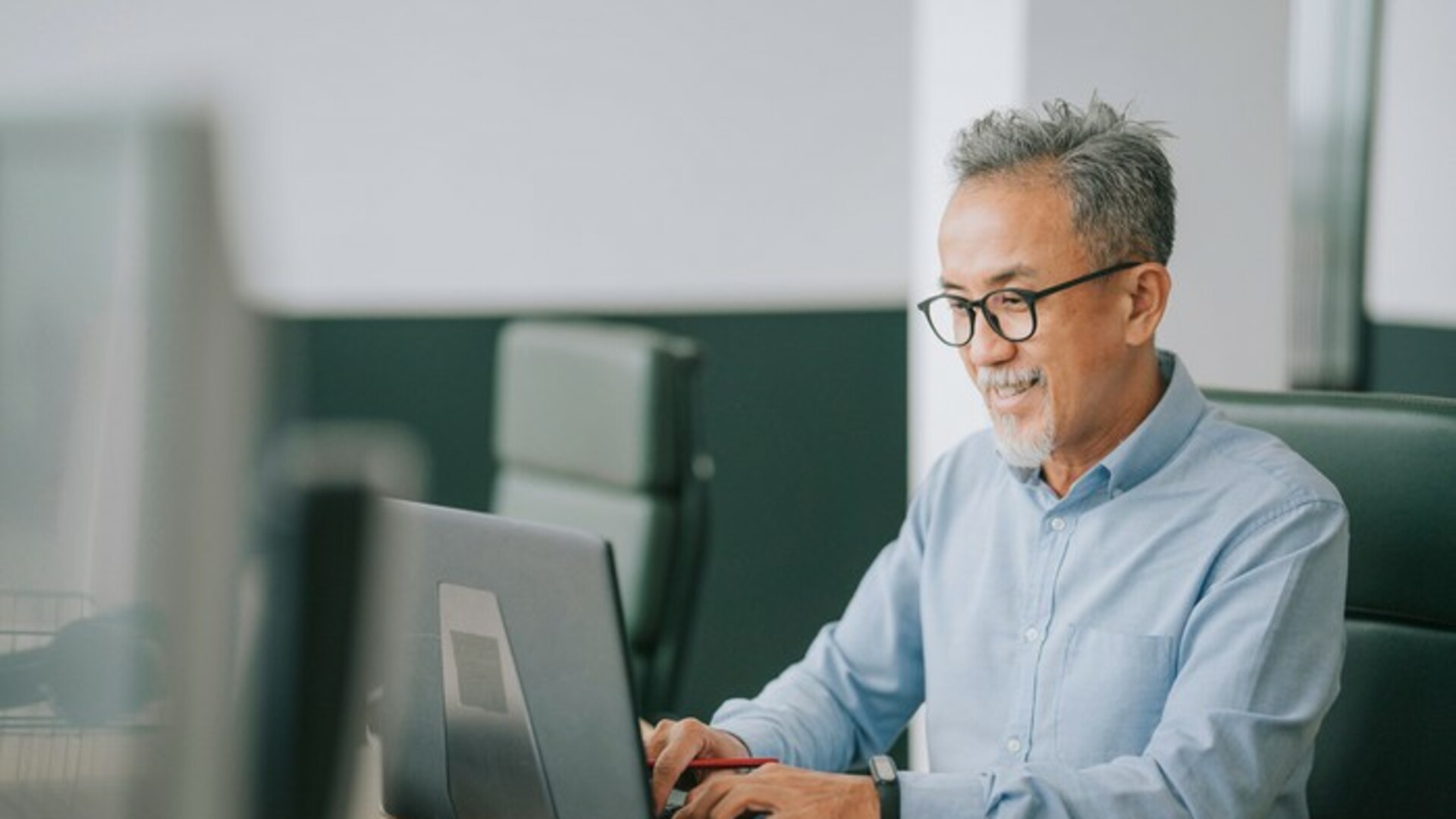 Asian man on laptop.jpg