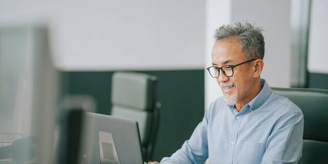 Asian man on laptop.jpg