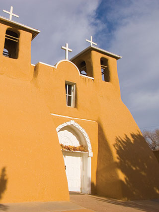 11009-new-mexico-santa-fe-taos-tale-of-two-cities-san-francisco-de-assisi-church-vert.jpg