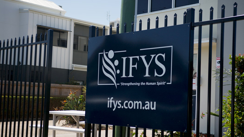 Photo of outside gates with IFYS sign.