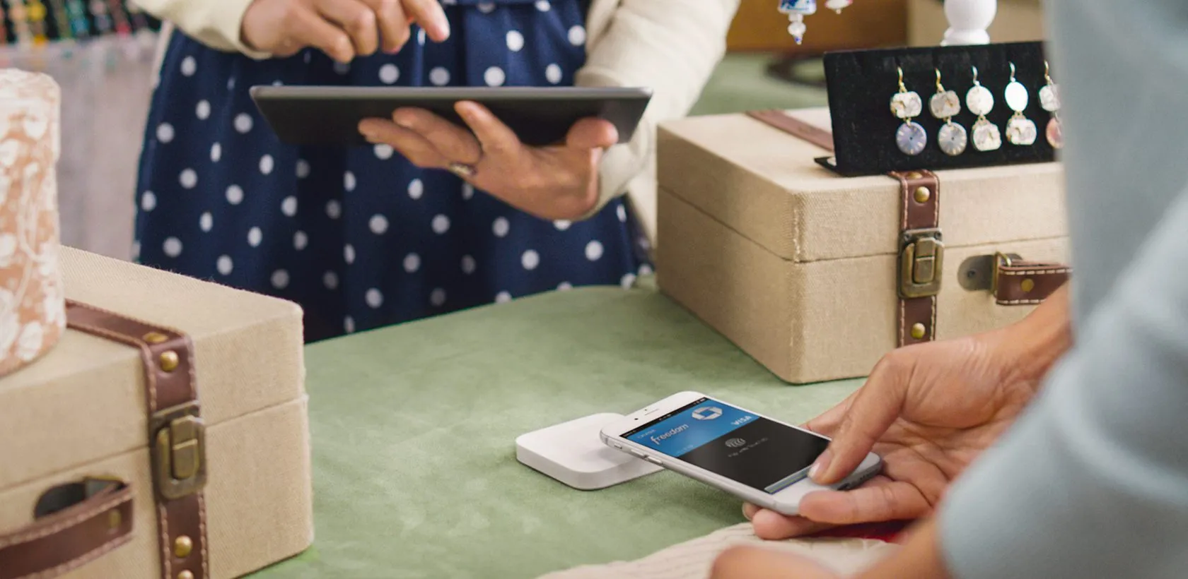 Woman paying with Apple Pay