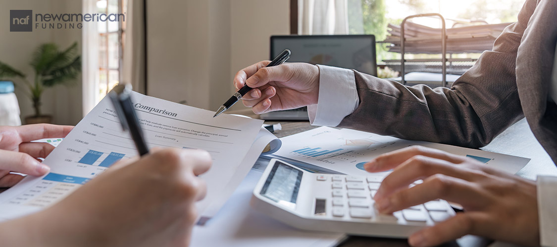 loan officer going over paperwork with homebuyer