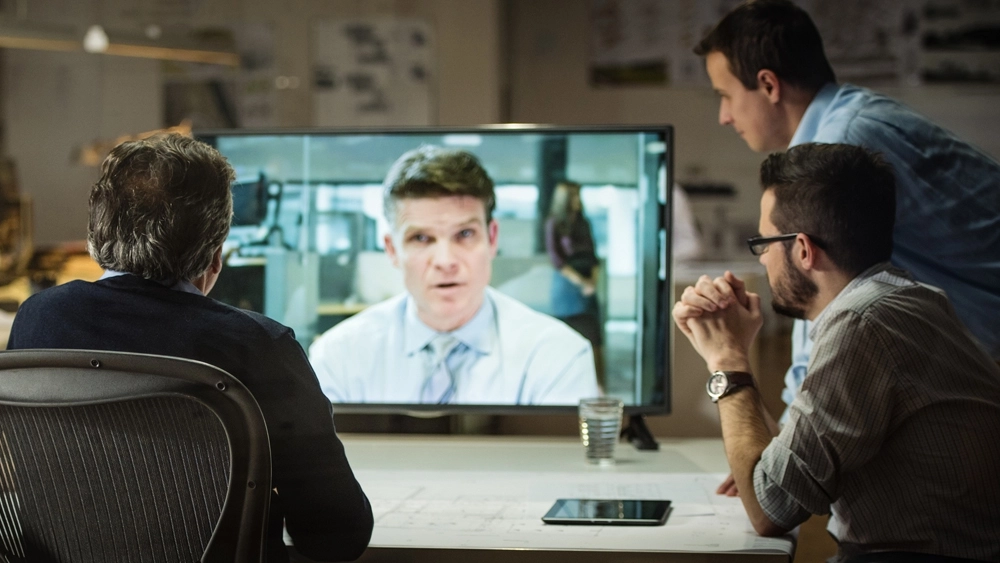 Stock image of Business-Workers-All-Watching-Screen