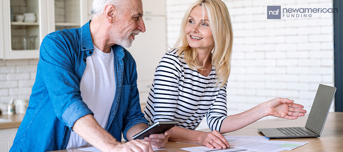 couple going over paperwork in the kitchen