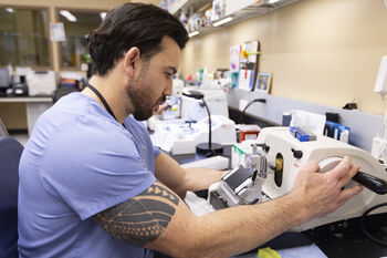 Claude Ferrari prepares samples in the ttisue core lab. The Rapid Tissue Donation Program has received 60 donations since it began.
