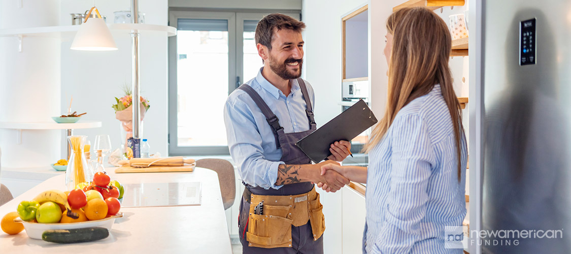 construction worker shaking his hands with the homeowner