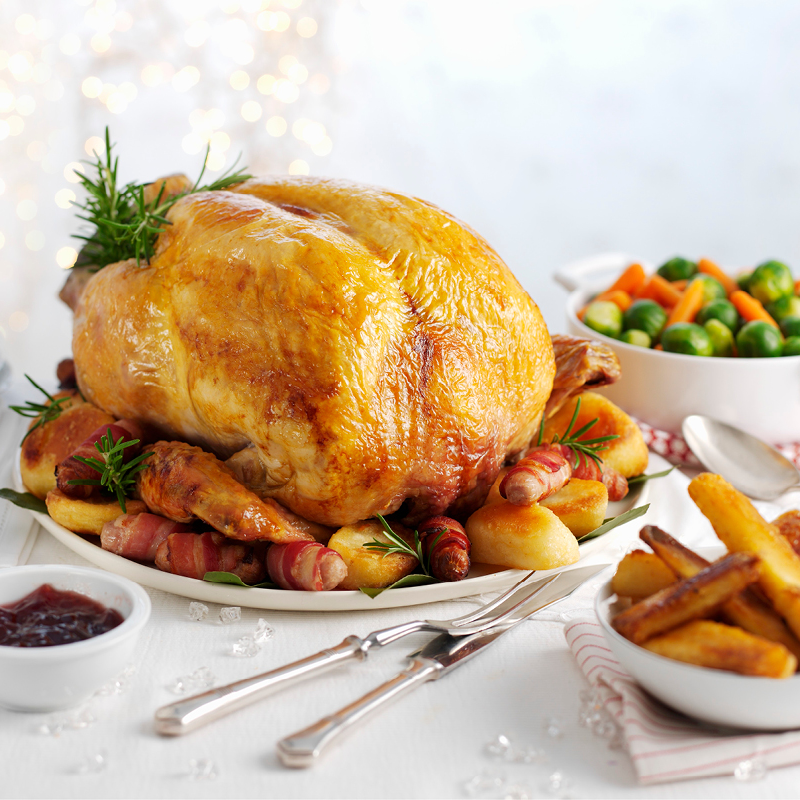 Roast Turkey and Vegetables cooked and ready on Christmas table