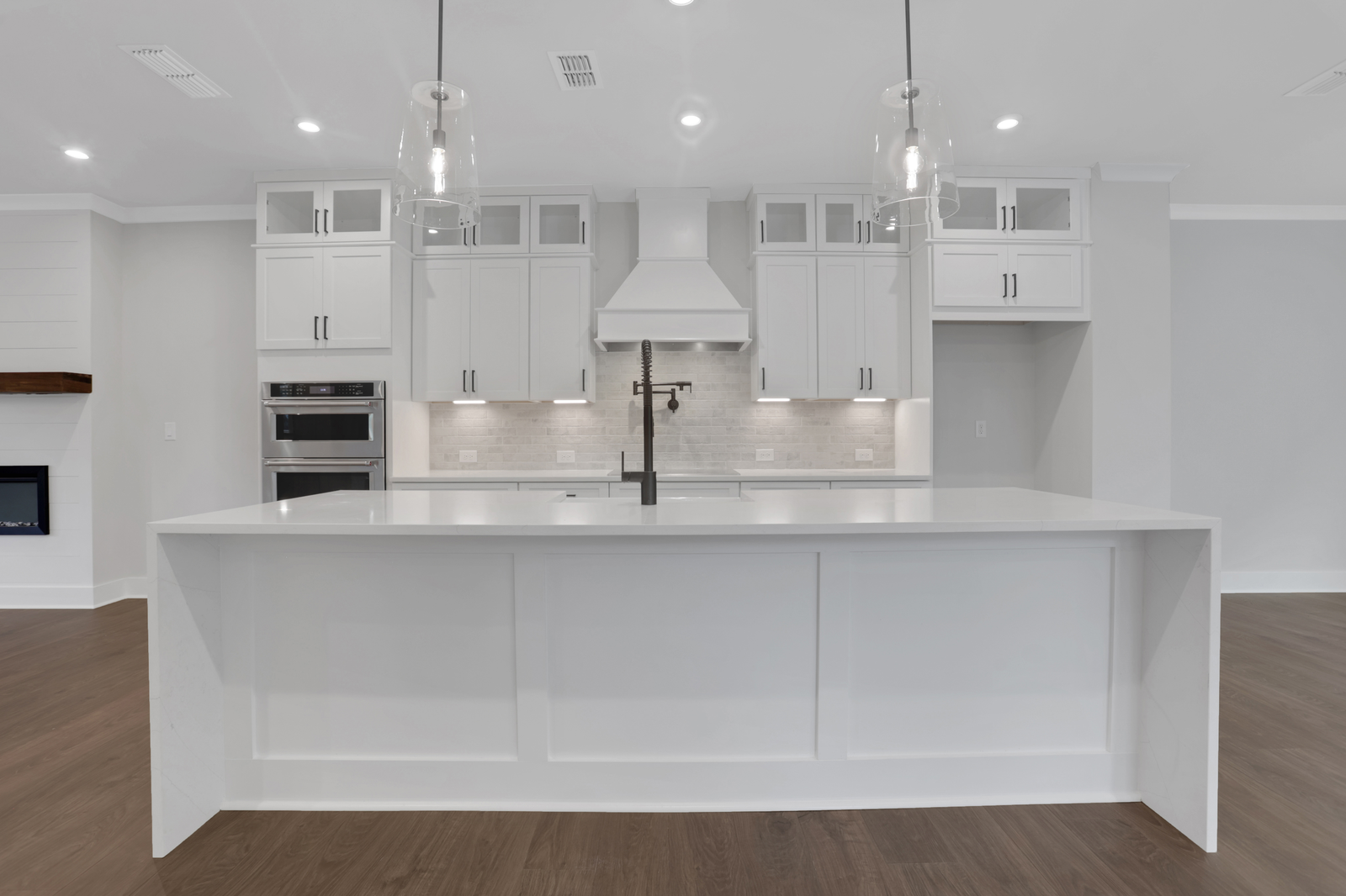 kitchen with white cabinets and quartz counters