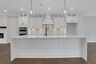 kitchen with white cabinets and quartz counters