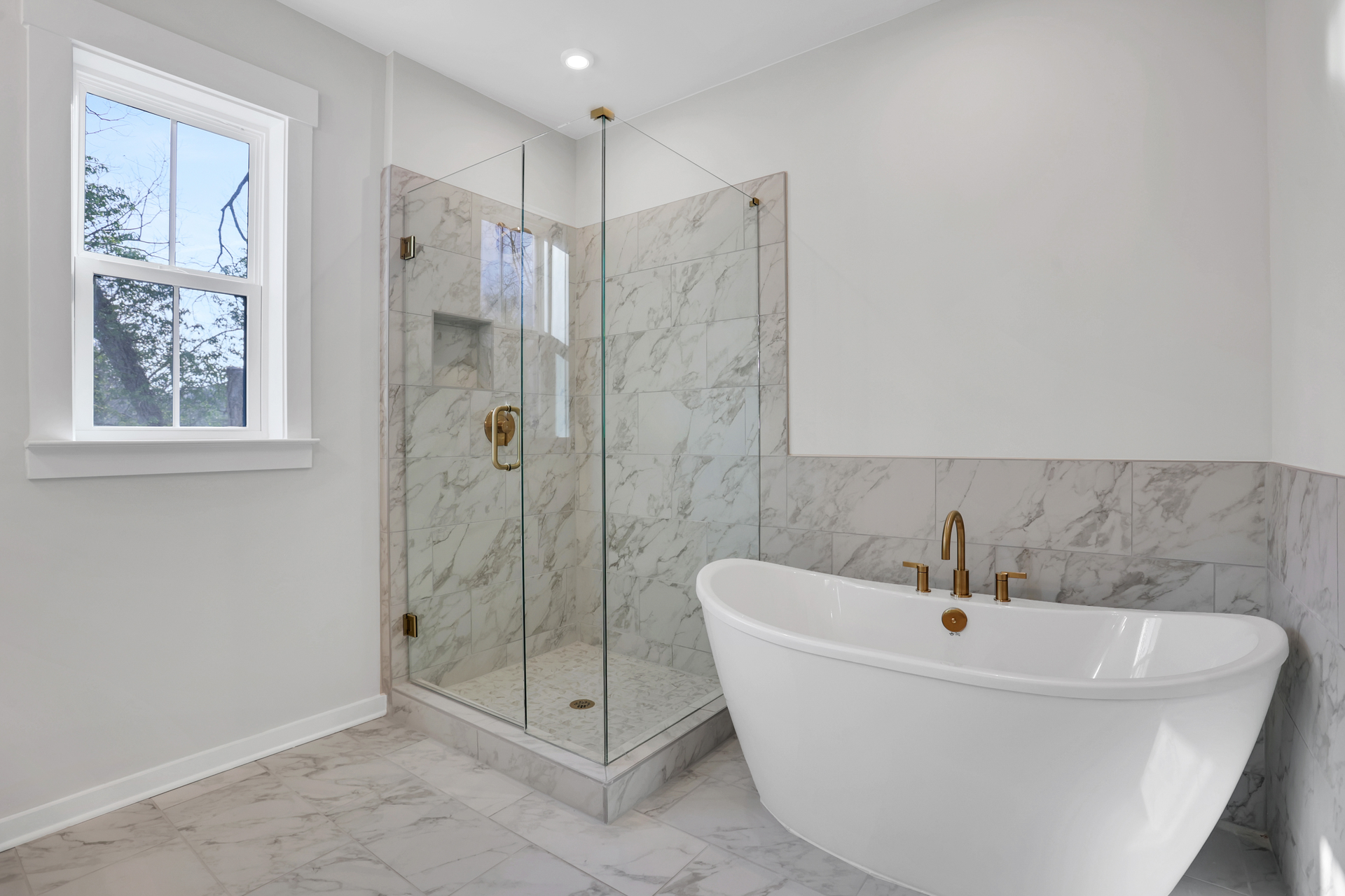 primary bathroom with separate shower and tub