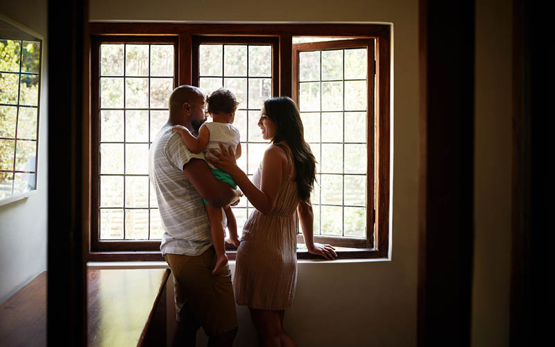 A person and person holding a baby