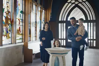 A family in a church entrance