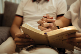 Holding hands while reading a book