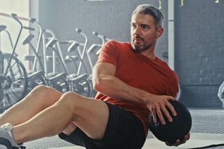 Man exercising with a ball
