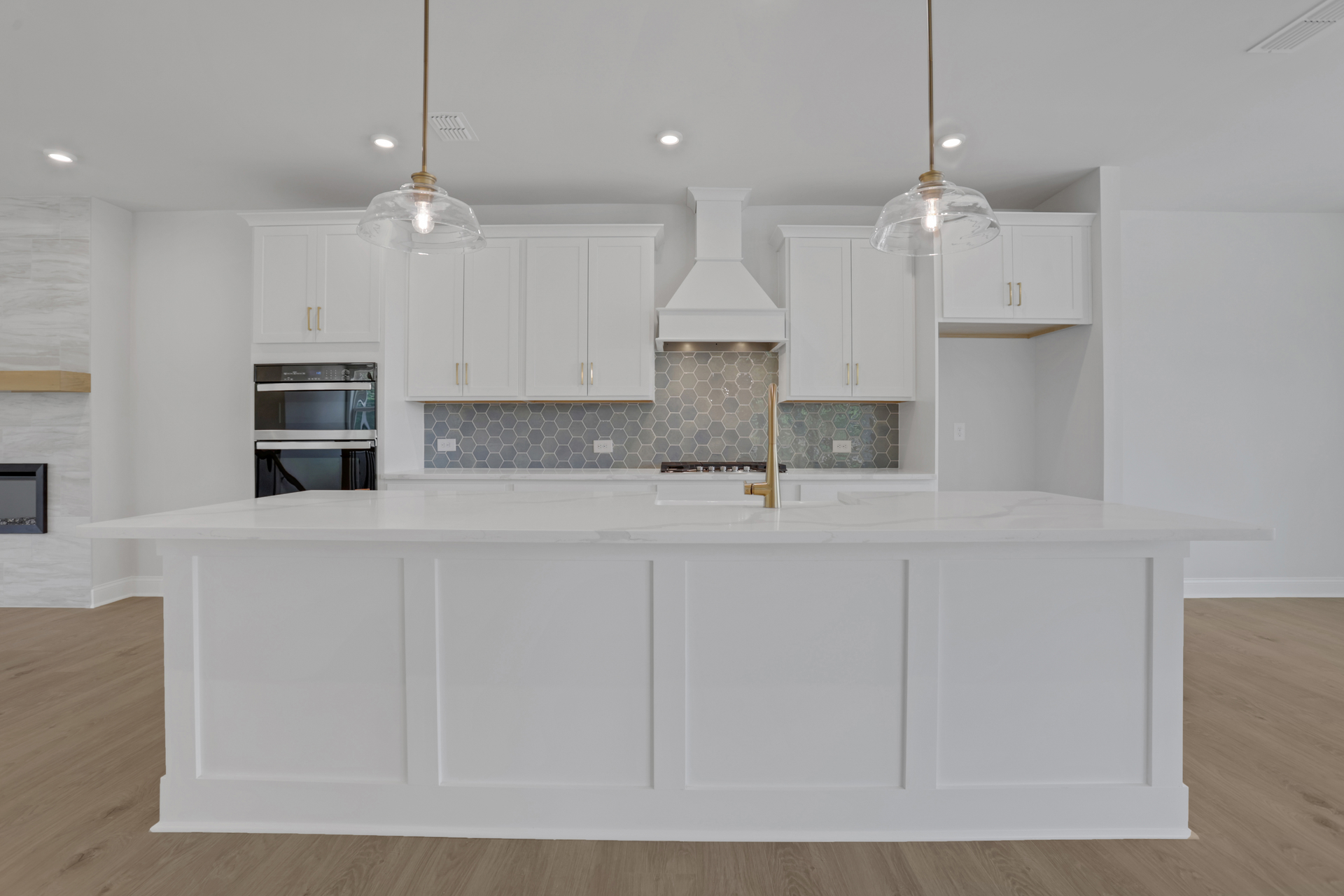 kitchen with white cabinets and quartz counters