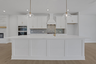 kitchen with white cabinets and quartz counters