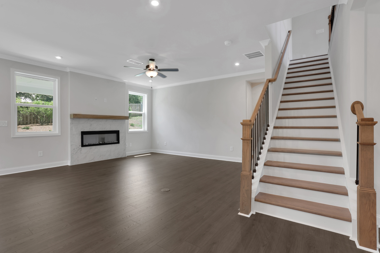 great room with electric fireplace and hard surface flooring