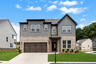 front of 2-story home with brick and dark siding