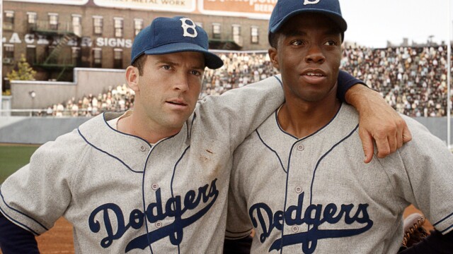 42 movie still with Chadwick Boseman in Dodgers uniform with teammate