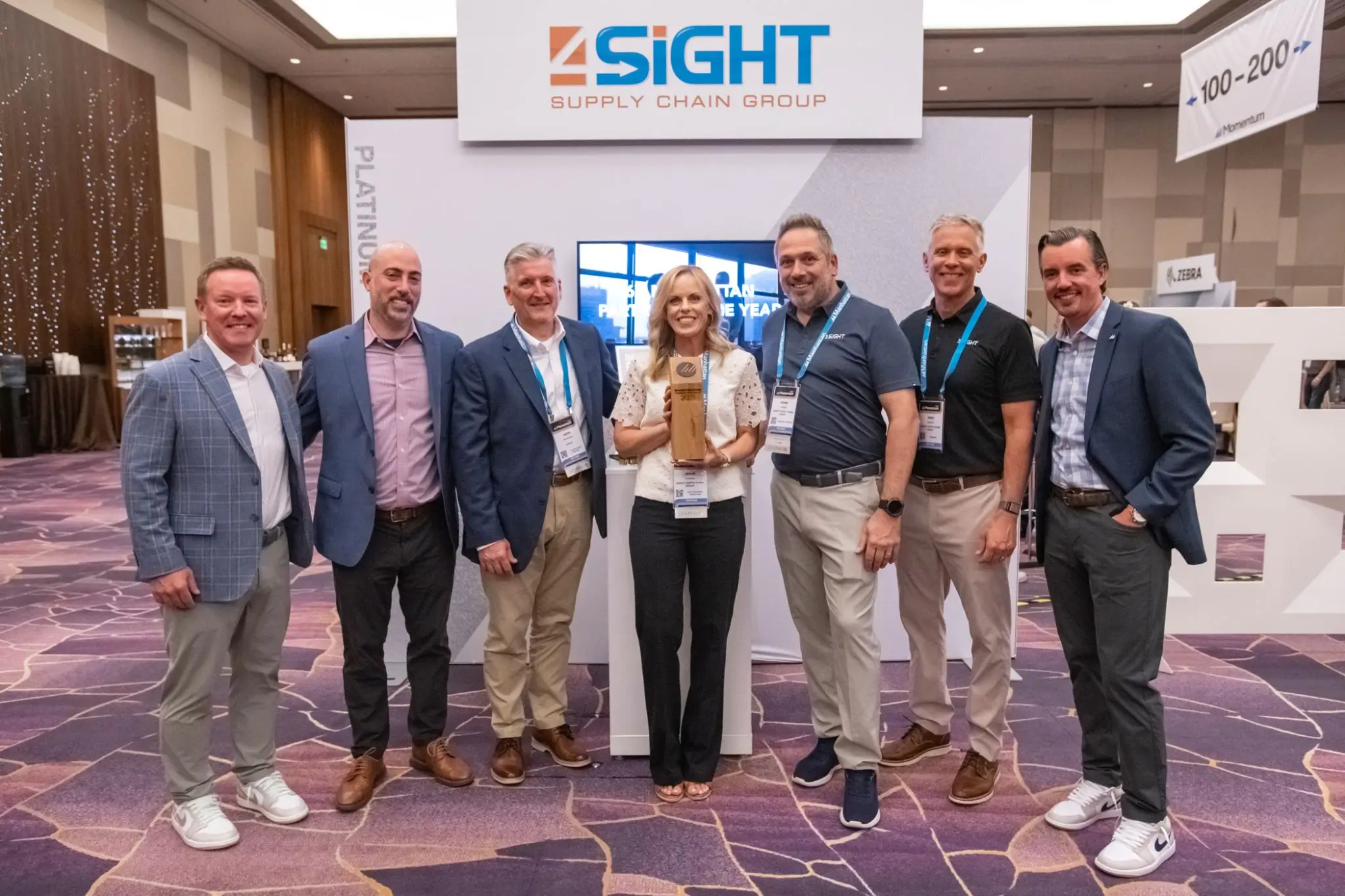 4sight-momentum.webp Pictures of people from 4Sight company receiving an award at Momentum 2025
