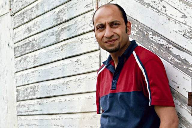 man standing outside building