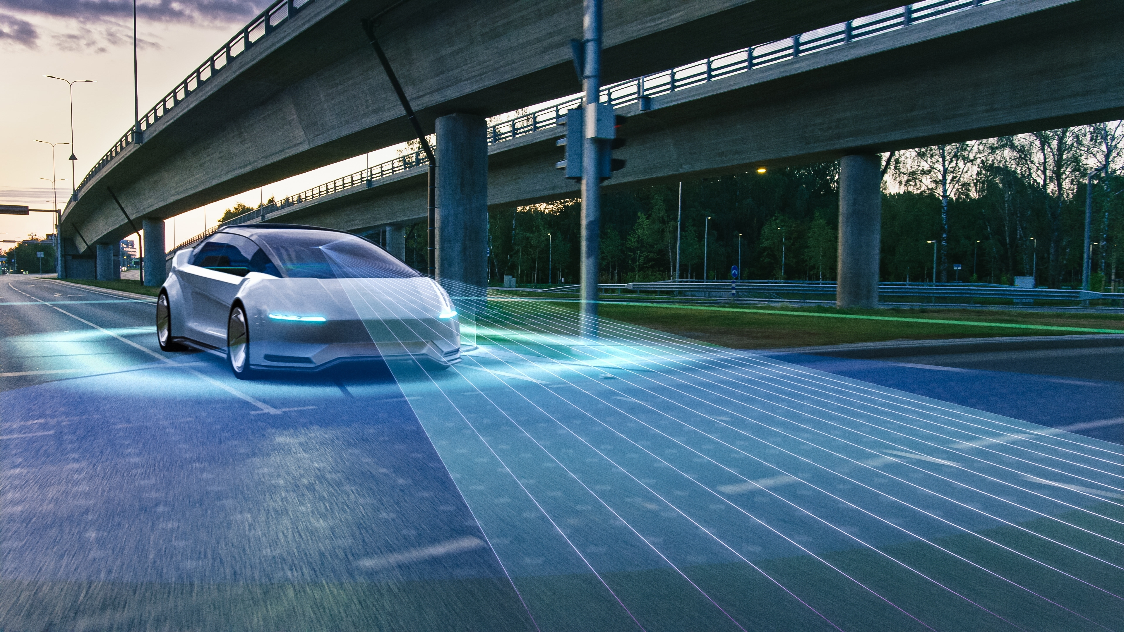 Futuristic car driving under a bridge, with blue sensor lines scanning the road ahead.