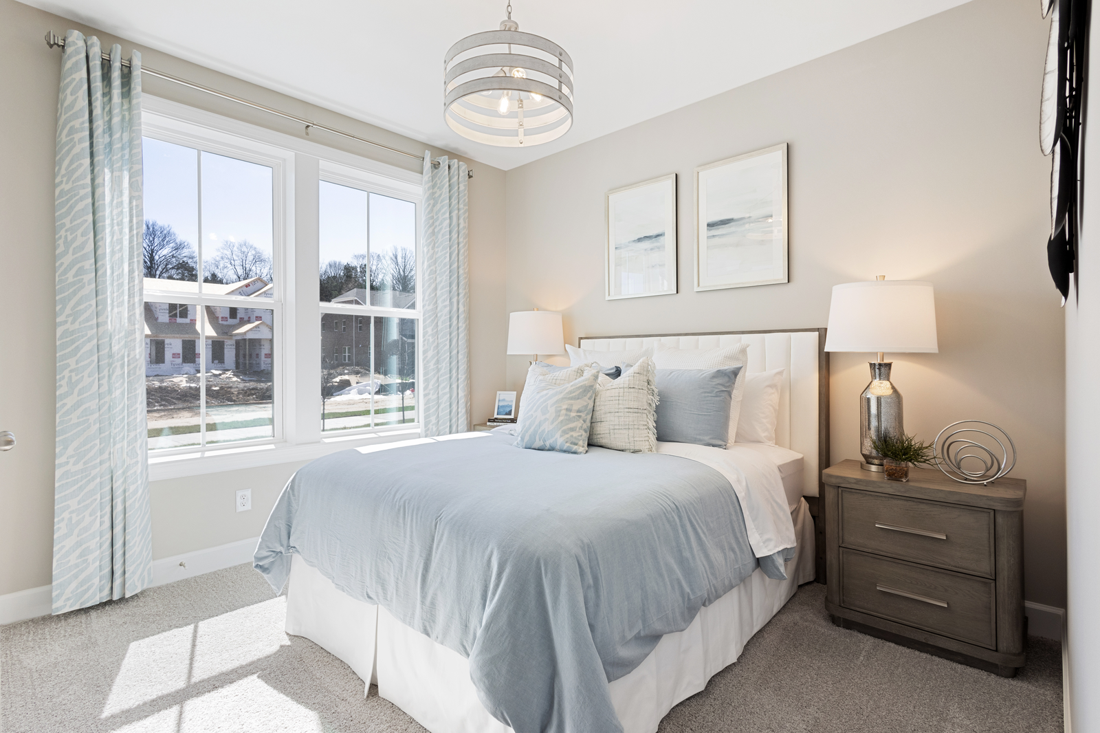 secondary bedroom with large windows and carpet