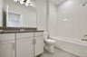 single sink vanity with water closet and shower