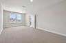 carpet throughout and multiple large windows