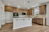 kitchen with wood cabinets, white countertops, and stainless steel appliances