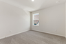 secondary bedroom with large windows and carpet