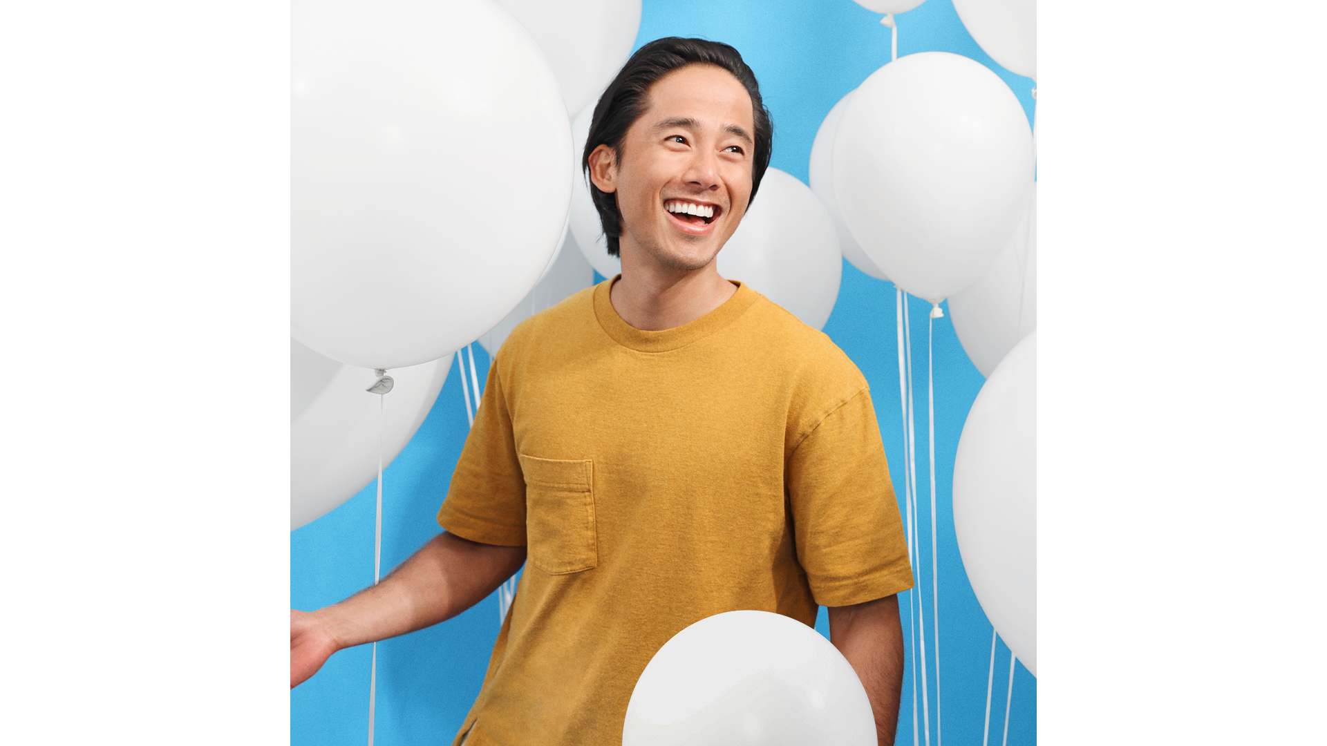 Bupa Dental man with a smile and balloons