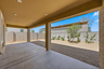extended covered patio with recessed lighting, ready for a day of entertainment and relaxation