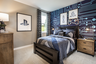 secondary bedroom with queen bed and carpet