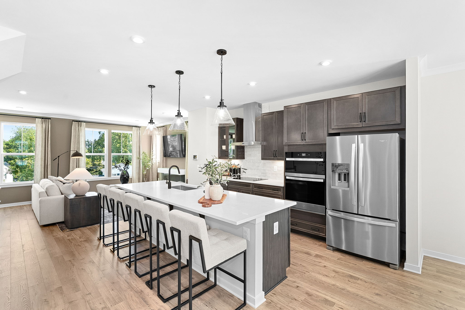 kitchen with center island adjacent to great room