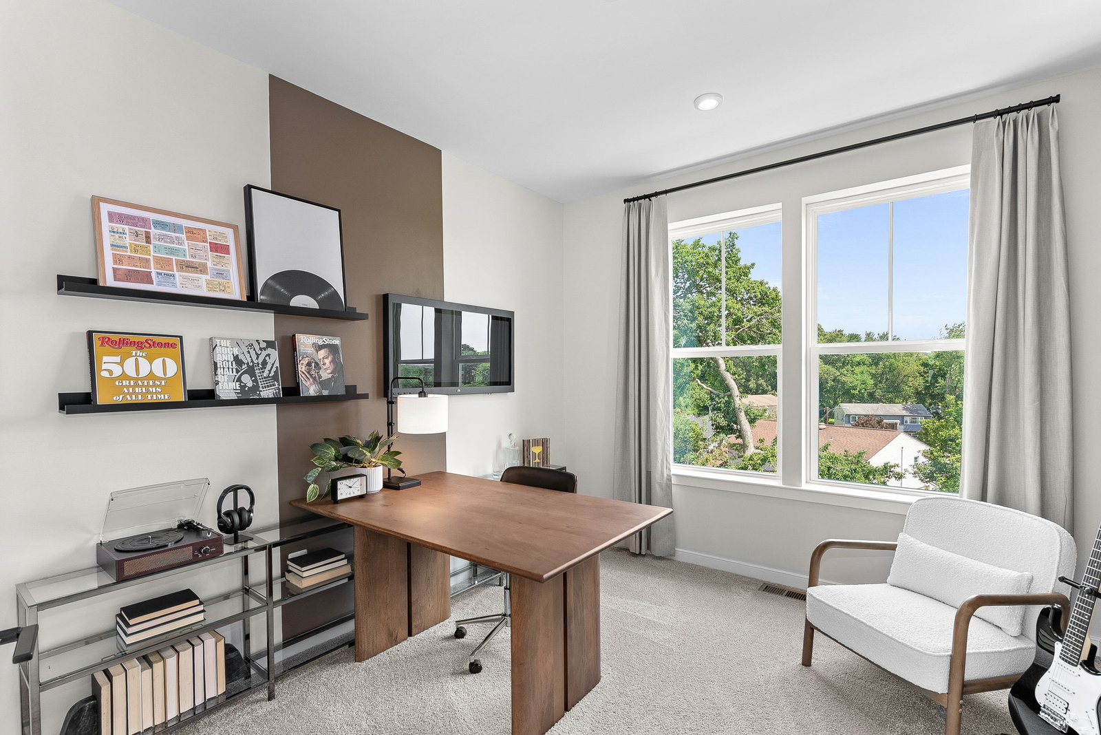 carpeted secondary bedroom with multiple windows