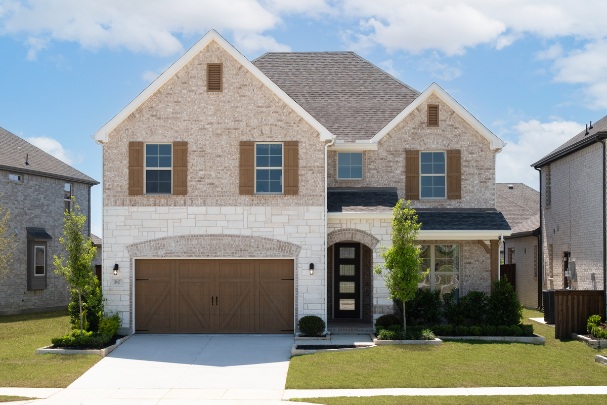 two-story home with brick and stone exterior