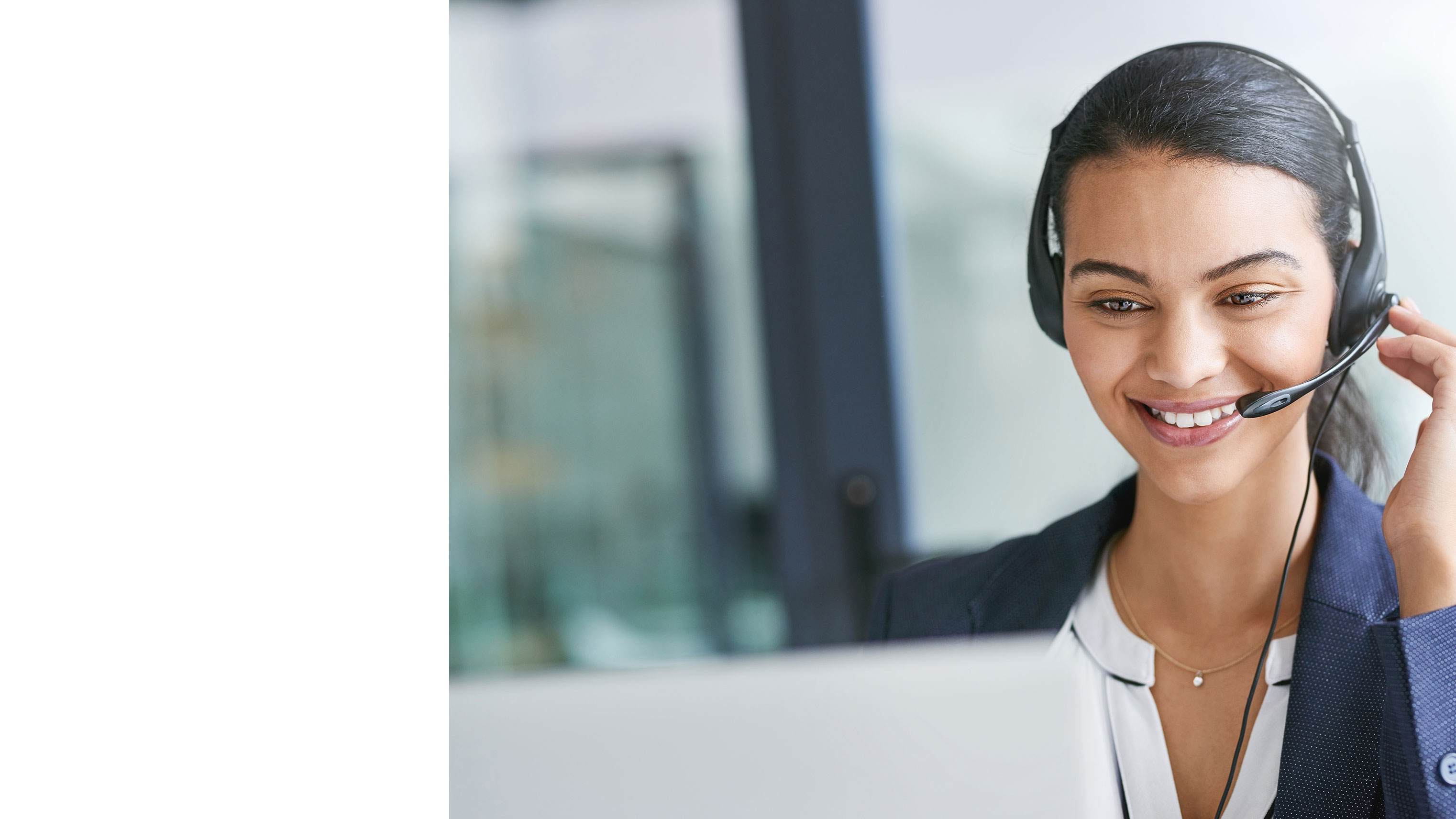 BoostSales-fix-desktop.jpg Female customer support assistant on the telephone at her desk