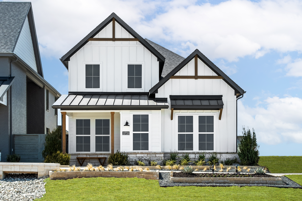 two-story home with white exterior and windows