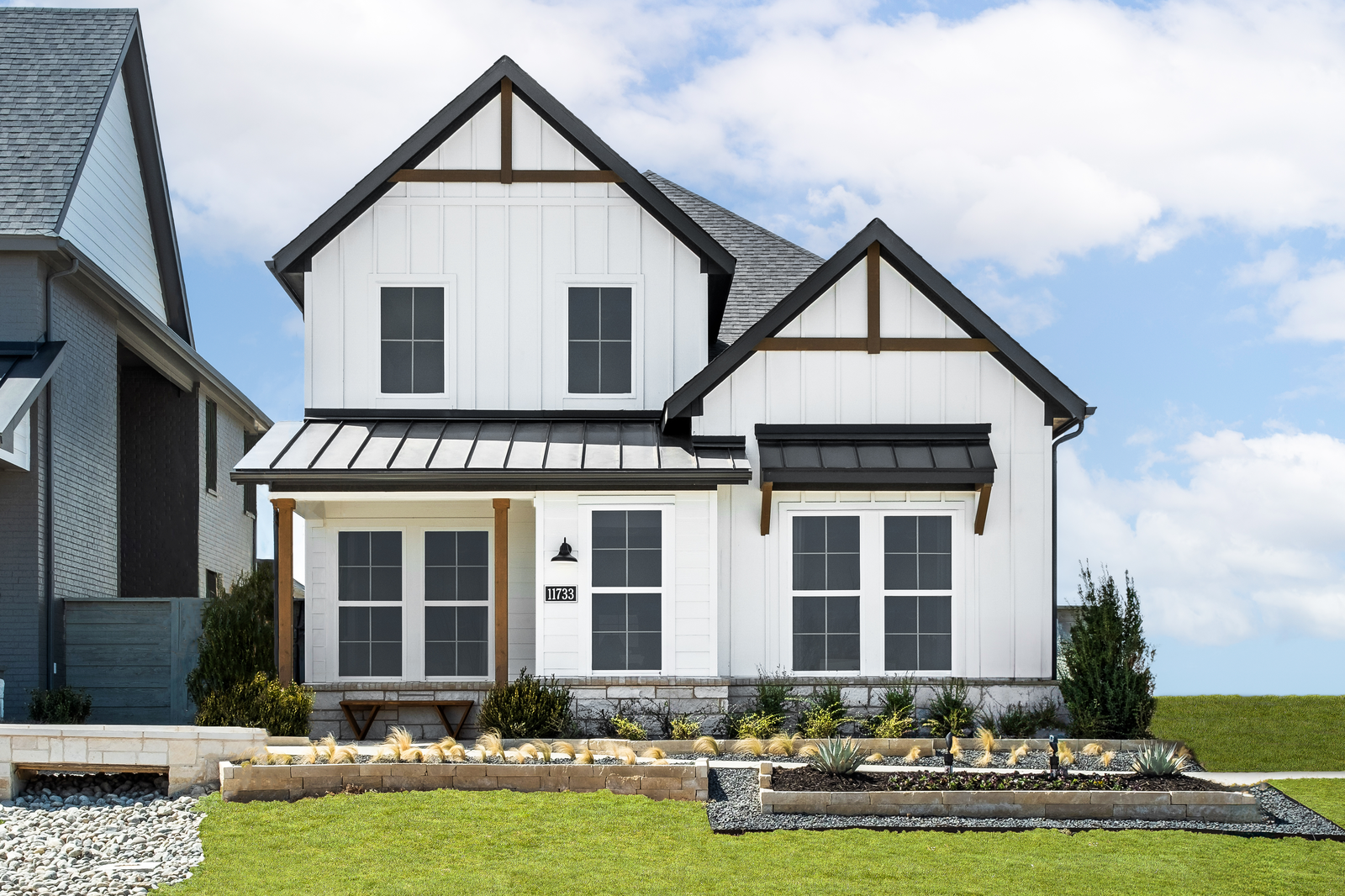 two-story home with white exterior and windows
