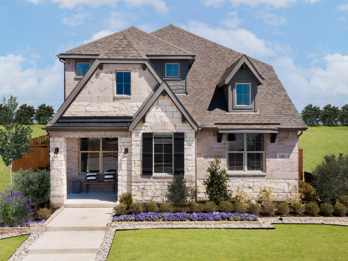 stone exterior with tree in side yard