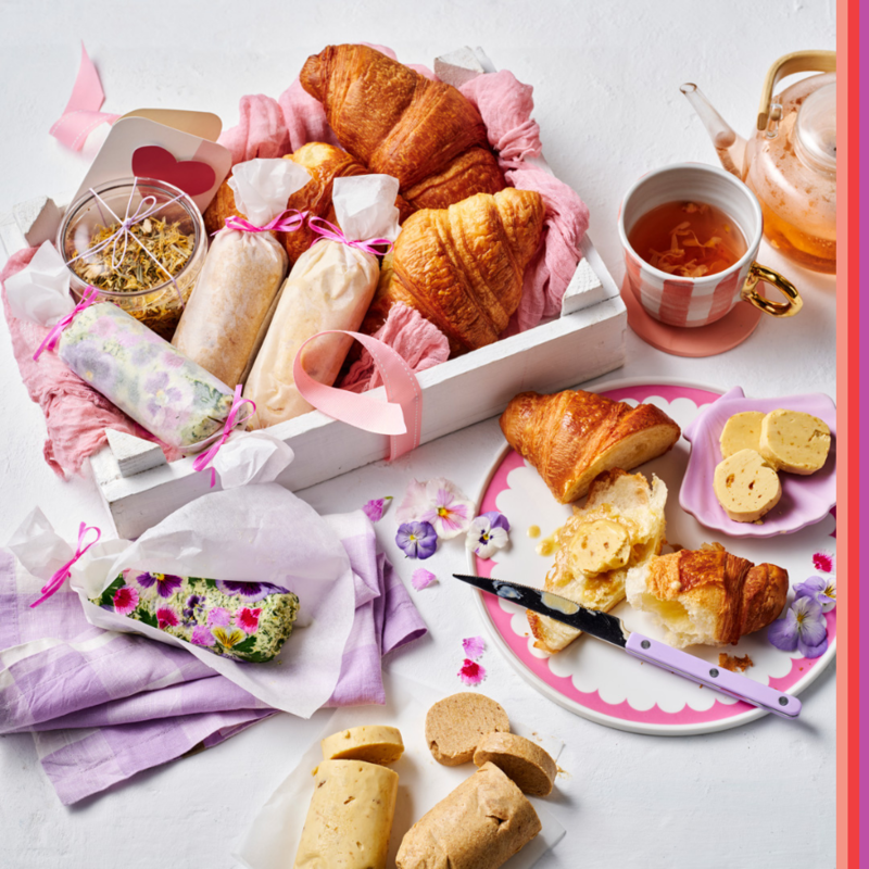 Freshly brewed tea in a glass pot served with croissant and home made butters for Mother's Day.