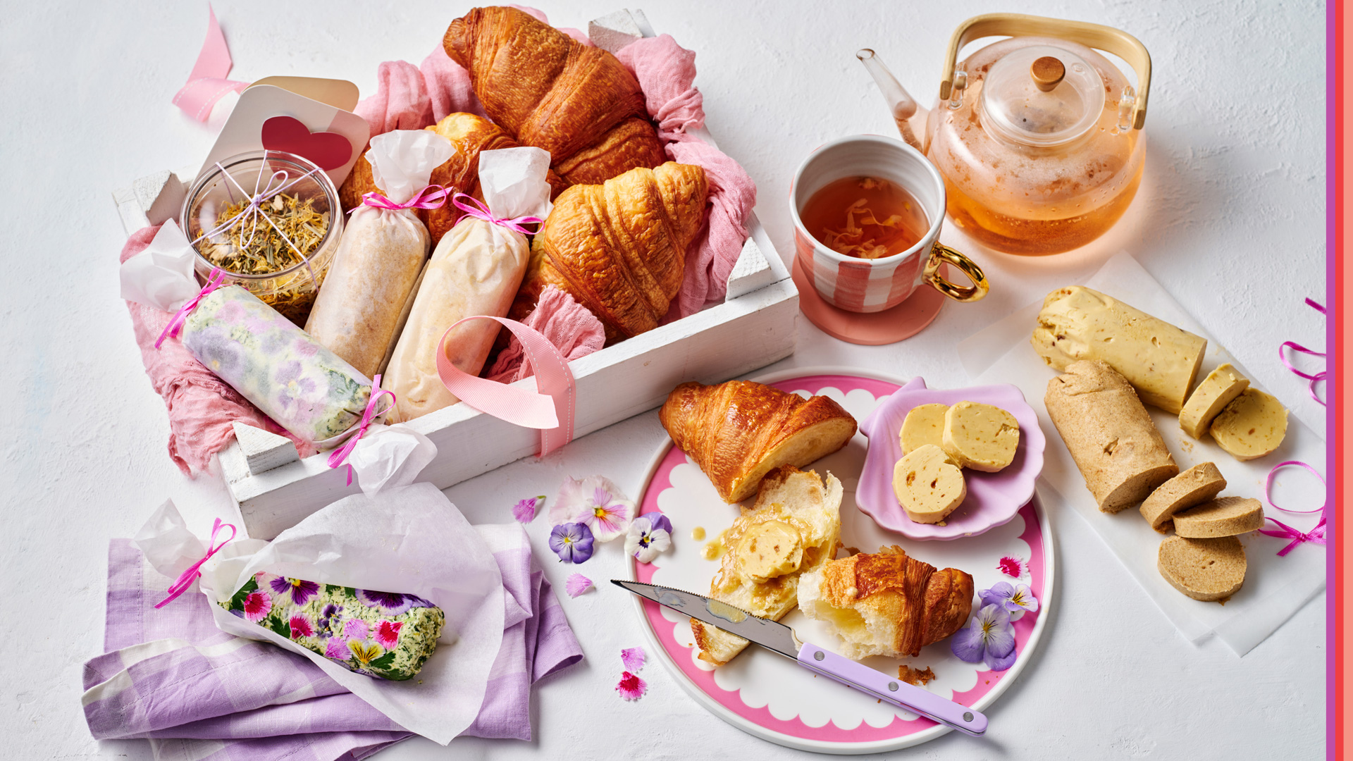 Freshly brewed tea in a glass pot served with croissant and home made butters for Mother's Day.